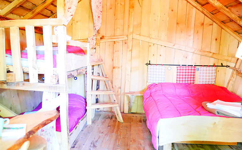 Outside view of the Wooden Hut of Gretel, rental of atypical cabins in Alsace at the Campsite Les Castors