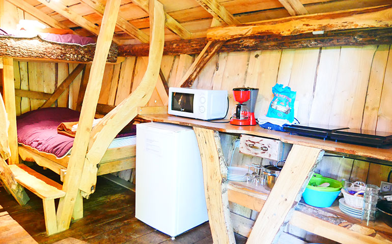 The two bedroom areas of the Wooden Hut of Hansel rental of atypical cabins in Alsace at the Campsite Les Castors