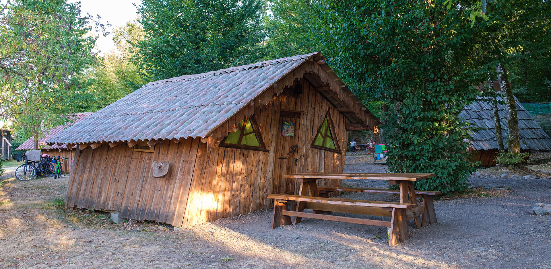 Outside view of the Wooden Hut of Hansel rental of atypical cabins in the Haut-Rhin at the Campsite Les Castors